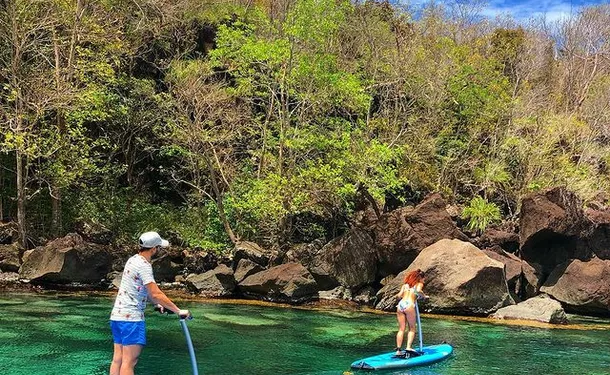Step paddle on translucent water