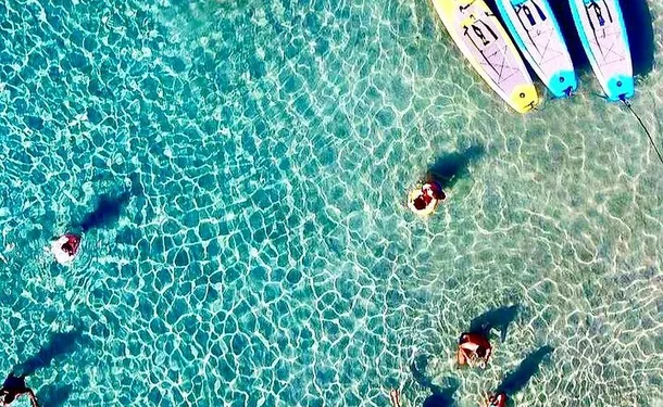 Step paddle on translucent water